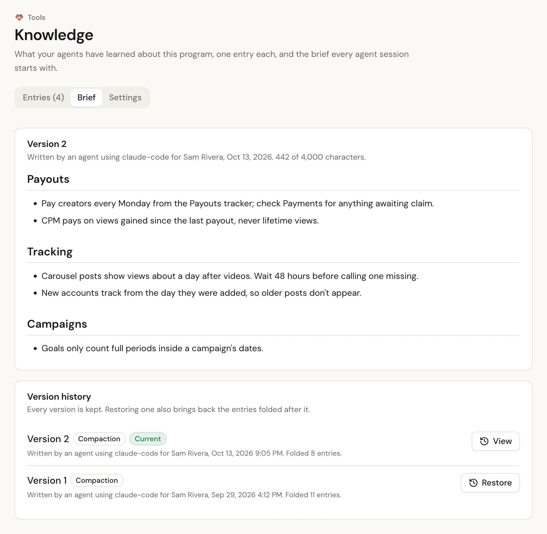 The brief tab: the current knowledge brief, written by an agent, and its version history with a Restore button.